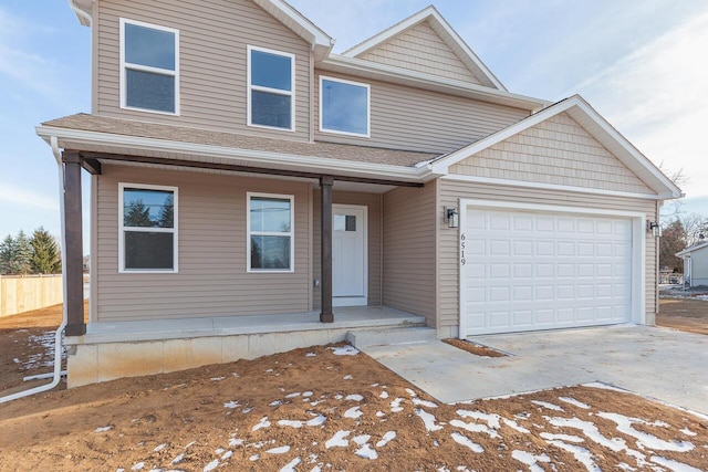 2023 Green Acres Dr, Adrian, MI 49221 - view of front of home featuring a porch, driveway, and a garage