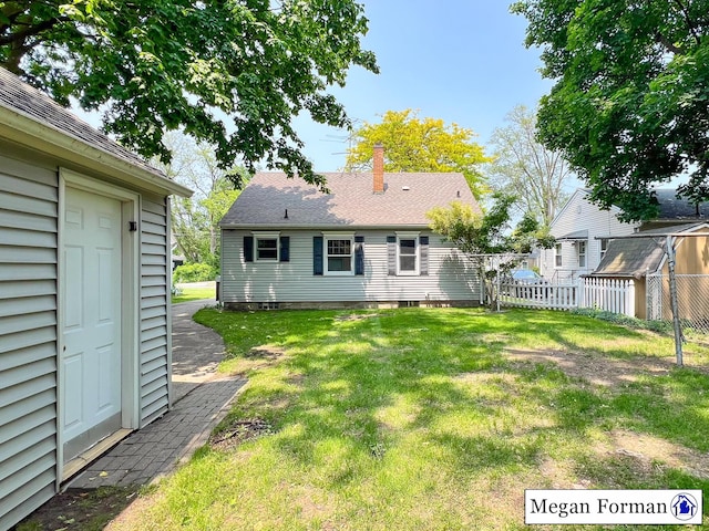 426 Mae-Thy St SE, Grand Rapids, MI 49548 - back of house with a chimney