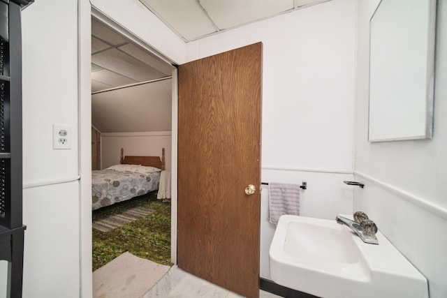 6387 N Larson Rd, Fountain, MI 49410 - bathroom featuring a sink and lofted ceiling