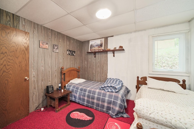 6387 N Larson Rd, Fountain, MI 49410 - carpeted bedroom with a drop ceiling and wooden walls