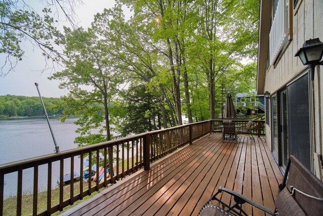 6387 N Larson Rd, Fountain, MI 49410 - deck with a water view and outdoor dining area
