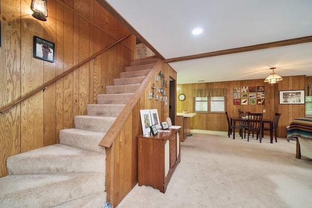 6387 N Larson Rd, Fountain, MI 49410 - staircase with wood walls and carpet flooring
