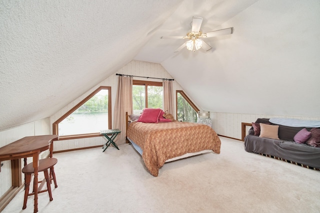 6387 N Larson Rd, Fountain, MI 49410 - carpeted bedroom featuring ceiling fan, lofted ceiling, and a textured ceiling