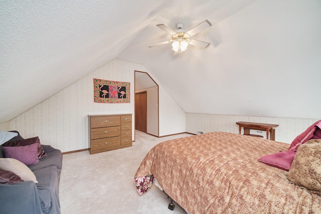 6387 N Larson Rd, Fountain, MI 49410 - bedroom featuring lofted ceiling, ceiling fan, light colored carpet, and a textured ceiling