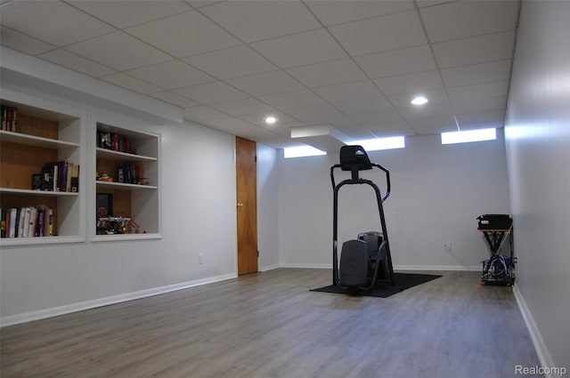 6560 Perham Dr, West Bloomfield, MI 48322 - exercise area featuring wood finished floors and built in features