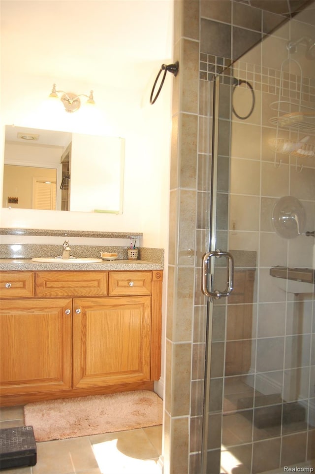 6560 Perham Dr, West Bloomfield, MI 48322 - bathroom with a stall shower, vanity, and tile patterned floors