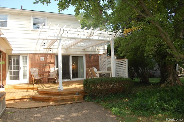 6560 Perham Dr, West Bloomfield, MI 48322 - back of house with a deck, brick siding, and a pergola