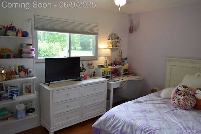 6009 Lancaster Dr, Flint, MI 48532 - bedroom featuring dark wood-style floors and a desk