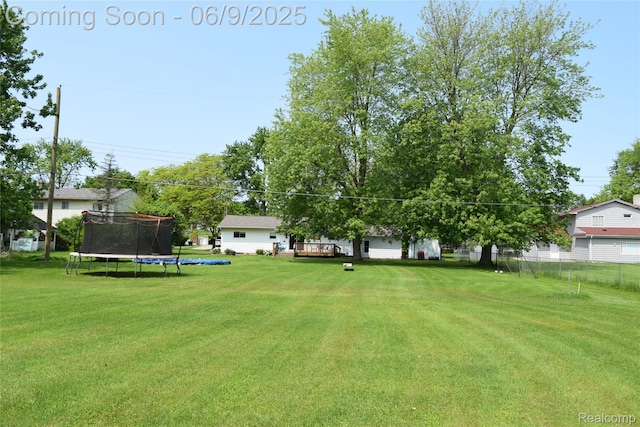 6009 Lancaster Dr, Flint, MI 48532 - view of yard with a trampoline