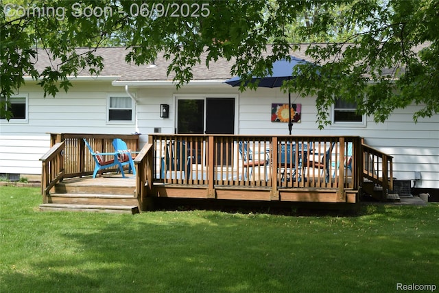 6009 Lancaster Dr, Flint, MI 48532 - back of house featuring a yard, a wooden deck, and a shingled roof