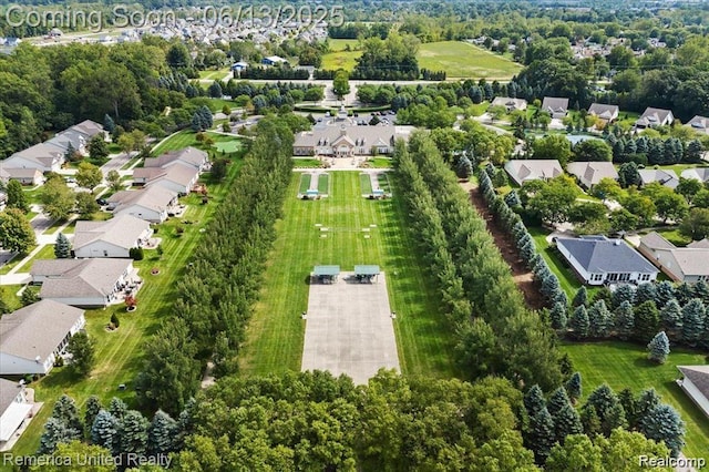 24168 Grand Traverse Ave, Flat Rock, MI 48134 - aerial view of property's location featuring nearby suburban area and a tree filled landscape