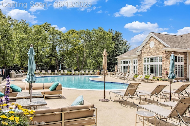 24168 Grand Traverse Ave, Flat Rock, MI 48134 - community pool with a patio and an outdoor living space