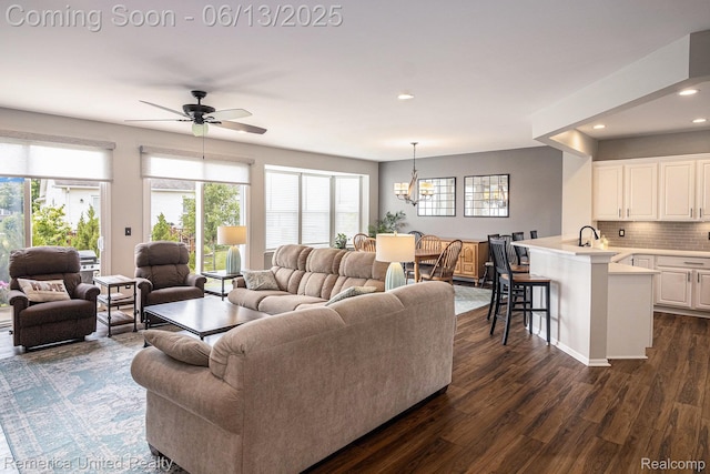 24168 Grand Traverse Ave, Flat Rock, MI 48134 - living room with a chandelier, dark wood-style floors, a ceiling fan, and recessed lighting
