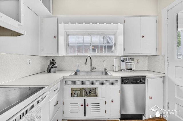 448 Borgess Ave, Monroe, MI 48162 - kitchen with dishwasher, a sink, light countertops, and white cabinets