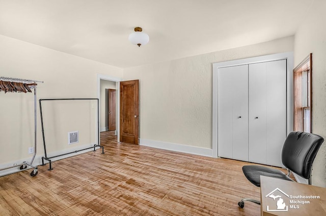 448 Borgess Ave, Monroe, MI 48162 - unfurnished office with wood finished floors and baseboard heating