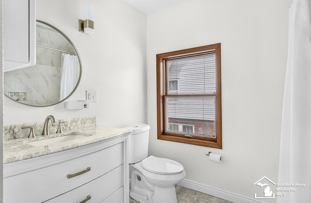448 Borgess Ave, Monroe, MI 48162 - bathroom with vanity, toilet, baseboards, and a shower with shower curtain