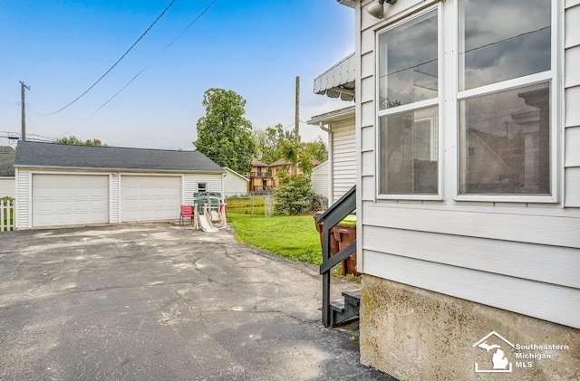 448 Borgess Ave, Monroe, MI 48162 - view of property exterior with an outdoor structure and a detached garage