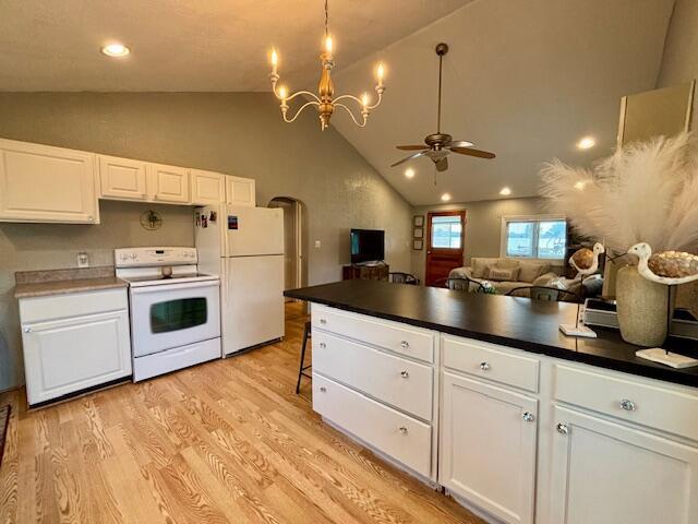 824 N Werners Landing Dr, Bronson, MI 49028 - kitchen with white appliances, ceiling fan, light wood-style flooring, dark countertops, and white cabinets