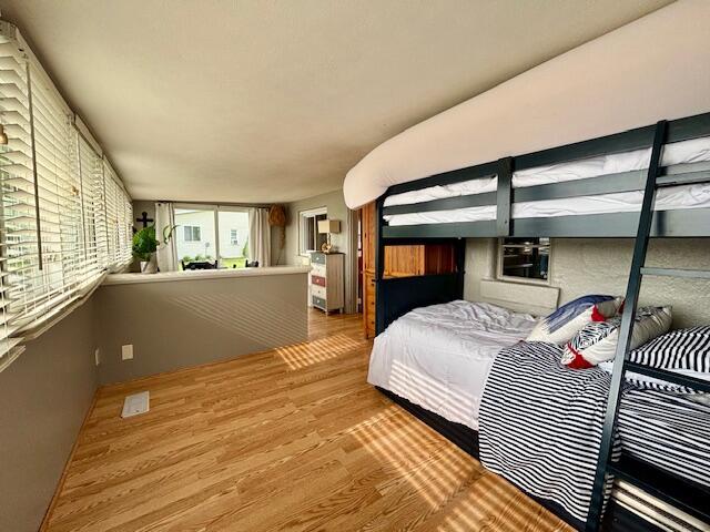 824 N Werners Landing Dr, Bronson, MI 49028 - bedroom featuring wood finished floors