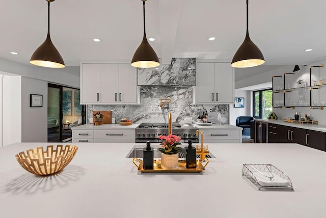 582 Campbell Rd, Saugatuck, MI 49453 - kitchen featuring decorative backsplash, light countertops, recessed lighting, and decorative light fixtures