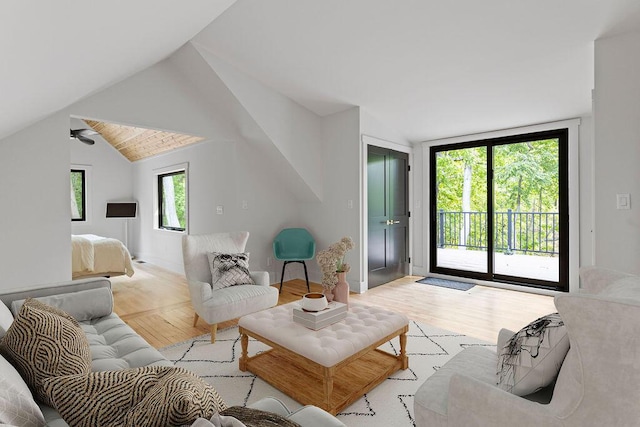 582 Campbell Rd, Saugatuck, MI 49453 - living area featuring wood finished floors, vaulted ceiling, and baseboards