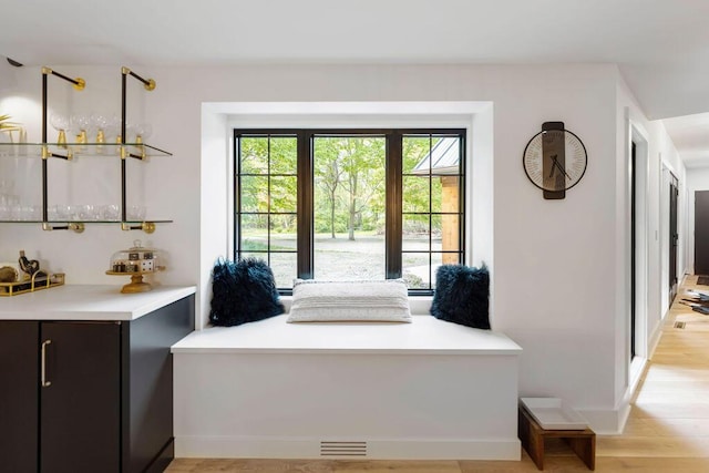 582 Campbell Rd, Saugatuck, MI 49453 - entryway featuring light wood finished floors, bar area, and baseboards