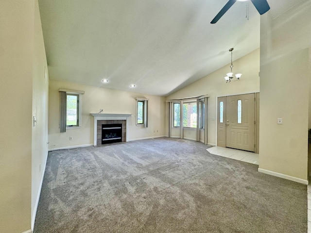 15338 Flanders St, Southgate, MI 48195 - unfurnished living room with baseboards, lofted ceiling, carpet floors, a ceiling fan, and a fireplace