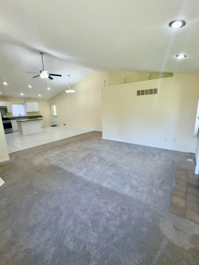 15338 Flanders St, Southgate, MI 48195 - unfurnished living room featuring vaulted ceiling, a ceiling fan, recessed lighting, and light carpet