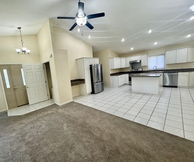 15338 Flanders St, Southgate, MI 48195 - kitchen featuring stainless steel appliances, dark countertops, a sink, light carpet, and a chandelier
