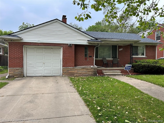 18499 Gruebner St, Detroit, MI 48234 - view of front of home featuring covered porch, an attached garage, a front lawn, brick siding, and concrete driveway