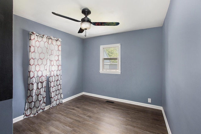 525 Riverview Ave, Monroe, MI 48162 - empty room featuring a ceiling fan, baseboards, and dark wood-style flooring