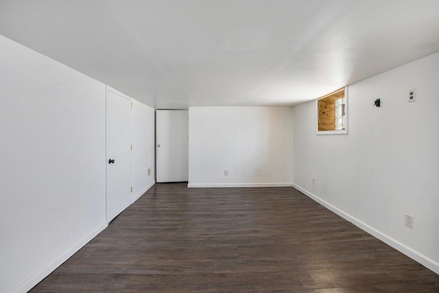 525 Riverview Ave, Monroe, MI 48162 - below grade area with dark wood-style flooring and baseboards