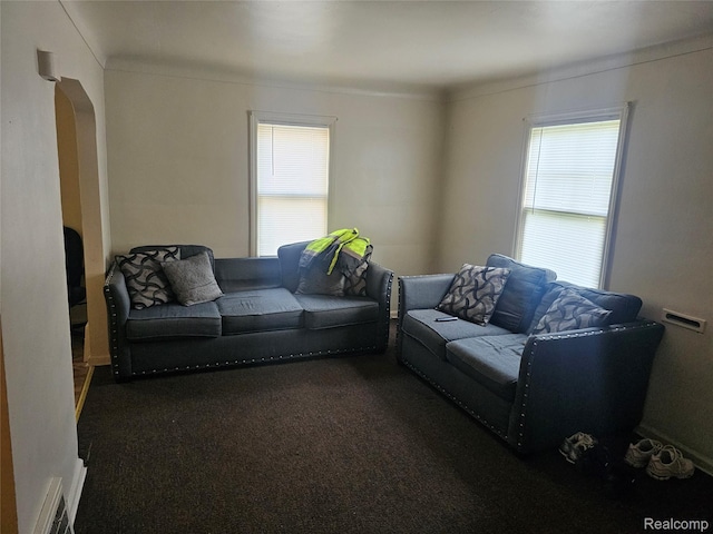 2730 Reynolds St, Flint, MI 48503 - living room featuring carpet flooring, arched walkways, and ornamental molding