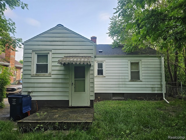 2730 Reynolds St, Flint, MI 48503 - rear view of house featuring a chimney
