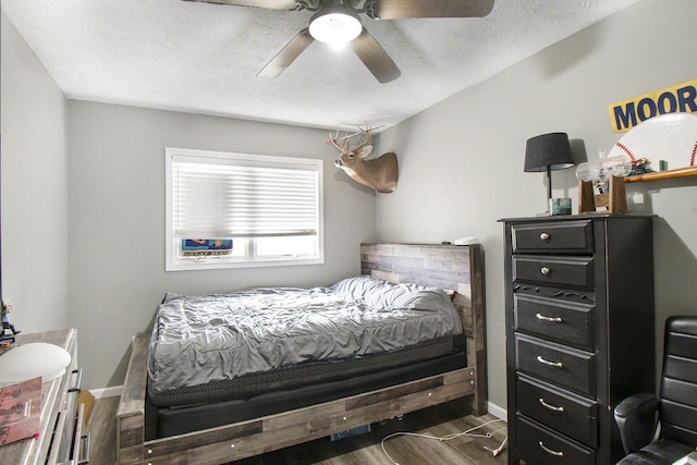 743 Fieldview Dr, Grand Ledge, MI 48837 - bedroom with a ceiling fan, baseboards, wood finished floors, and a textured ceiling