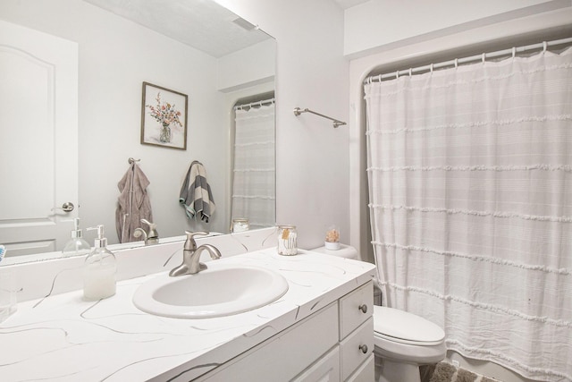 743 Fieldview Dr, Grand Ledge, MI 48837 - bathroom featuring vanity, toilet, and a shower with shower curtain