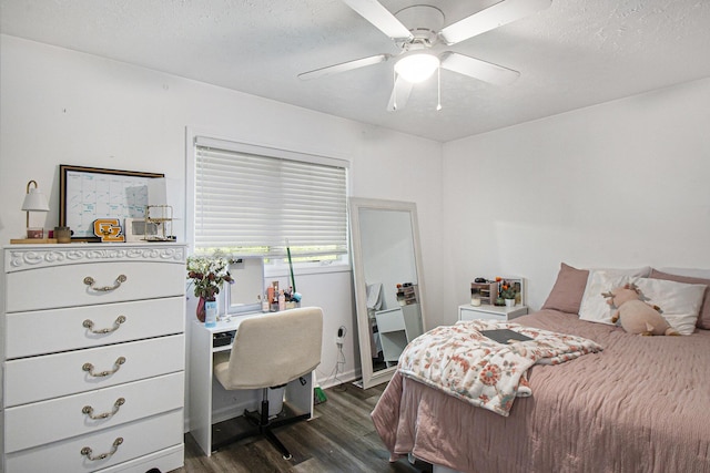 743 Fieldview Dr, Grand Ledge, MI 48837 - bedroom featuring dark wood finished floors, a desk, a textured ceiling, and ceiling fan