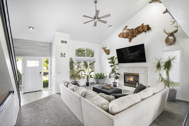 743 Fieldview Dr, Grand Ledge, MI 48837 - tiled living area featuring high vaulted ceiling, ceiling fan, a tile fireplace, baseboards, and recessed lighting