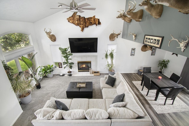 743 Fieldview Dr, Grand Ledge, MI 48837 - living room featuring ceiling fan, a fireplace, baseboards, wood finished floors, and high vaulted ceiling