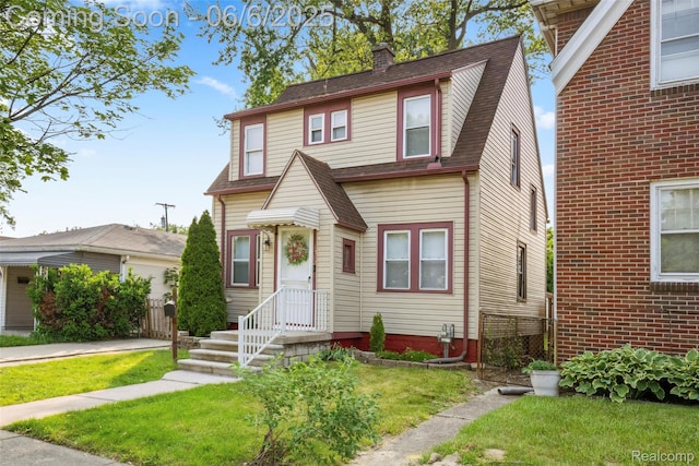 1512 Marion Ave, Lincoln Park, MI 48146 - view of front of property featuring a chimney and roof with shingles