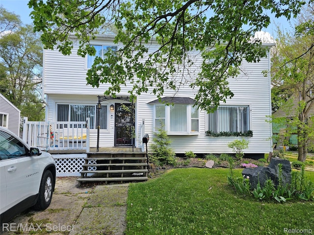3802 Milbourne Ave, Flint, MI 48504 - view of front of property with a deck and a front lawn