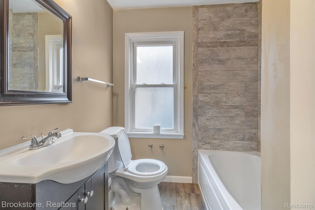 11727 Virgil, Redford, MI 48239 - full bathroom with toilet, a tub to relax in, vanity, baseboards, and wood finished floors