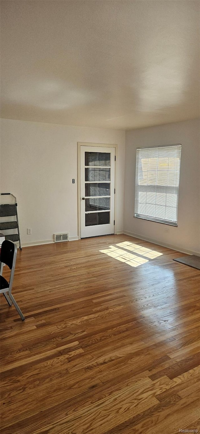 18966 Mendota St, Detroit, MI 48221 - unfurnished living room with wood finished floors