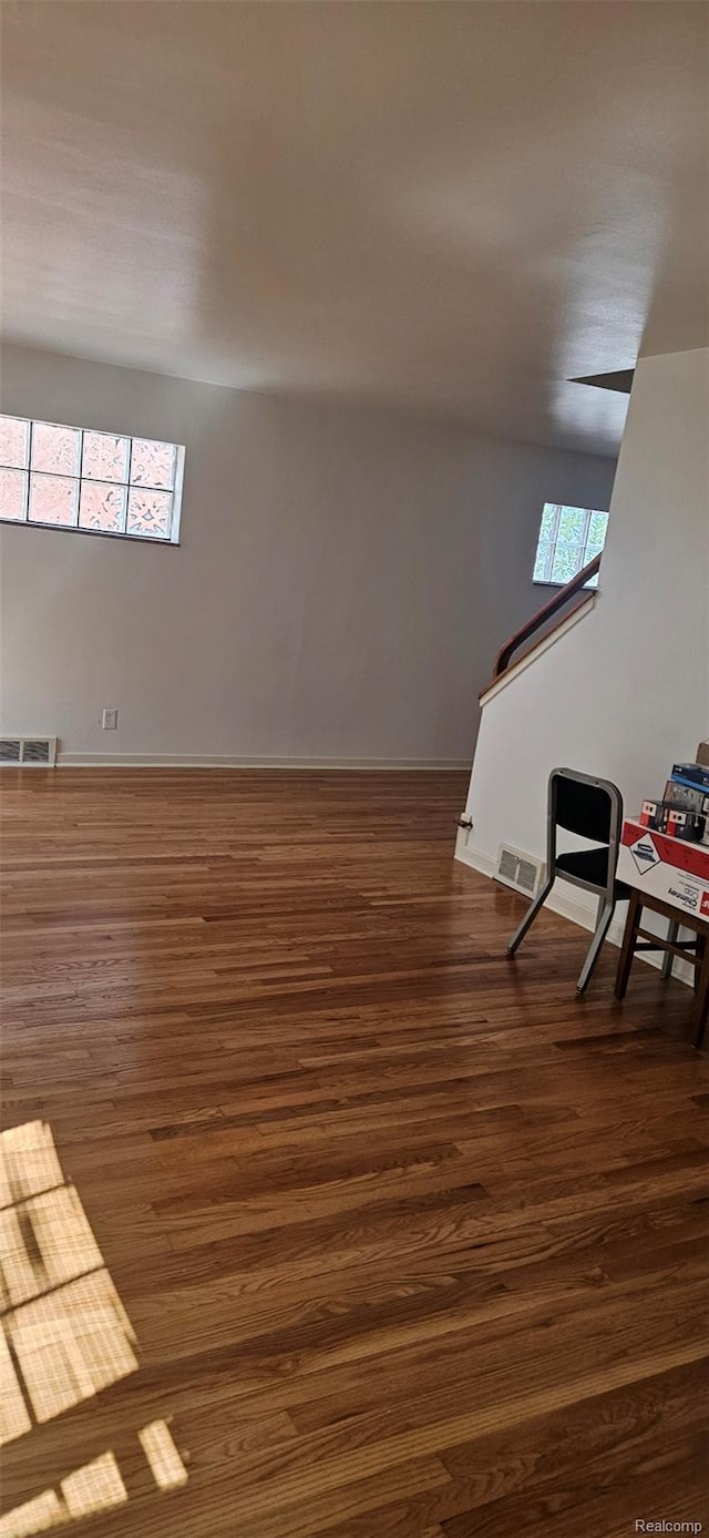18966 Mendota St, Detroit, MI 48221 - sitting room with dark wood-style flooring and an upstairs landing