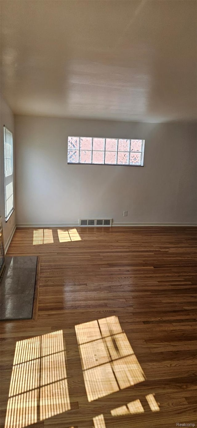 18966 Mendota St, Detroit, MI 48221 - spare room featuring wood finished floors and healthy amount of natural light