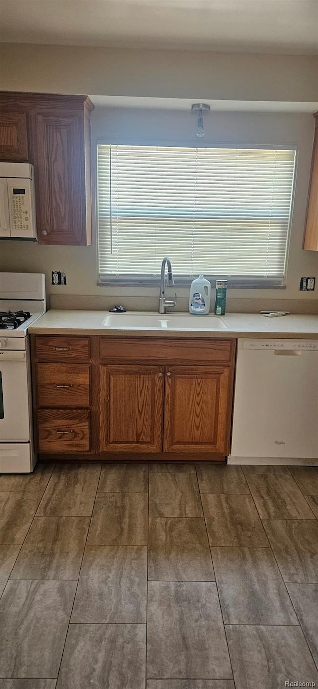 18966 Mendota St, Detroit, MI 48221 - kitchen with white appliances, light countertops, and plenty of natural light