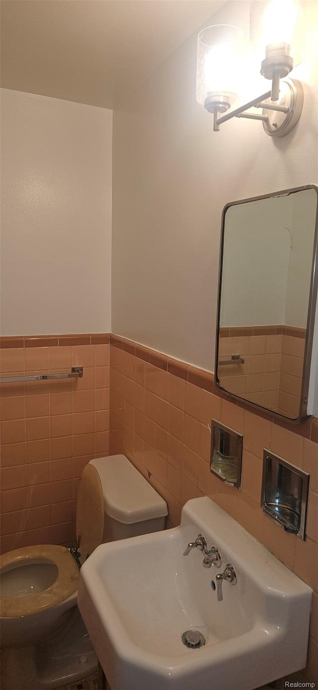 18966 Mendota St, Detroit, MI 48221 - half bath with tile walls and wainscoting