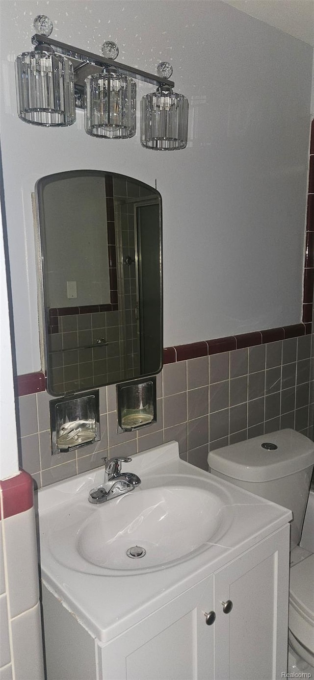 18966 Mendota St, Detroit, MI 48221 - bathroom featuring vanity, tile walls, and tasteful backsplash