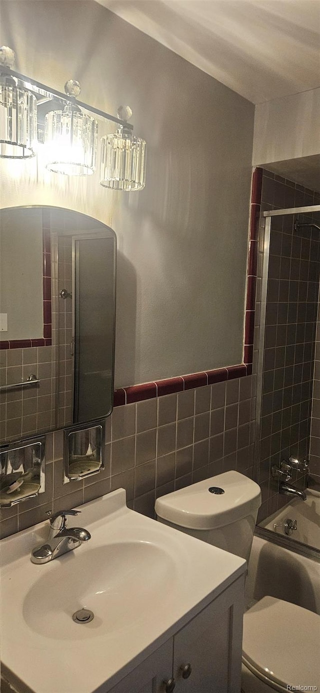 18966 Mendota St, Detroit, MI 48221 - bathroom with tile walls, vanity, and  shower combination