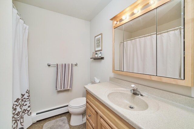 819 Elm St, Manistee, MI 49660 - bathroom featuring a baseboard radiator, vanity, and toilet